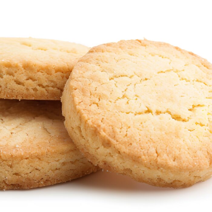 On white, three round shortbread biscuits are isolated, Generative AI.